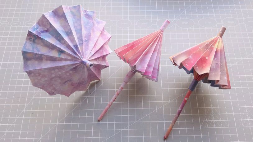折纸古风小雨伞,是可以伸缩的,您也折一个玩玩吧